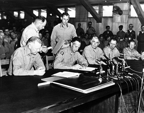 On July 27, 1953, UN Commander General Mark Clark signs the Armistice Agreement. The war did not end — it paused.