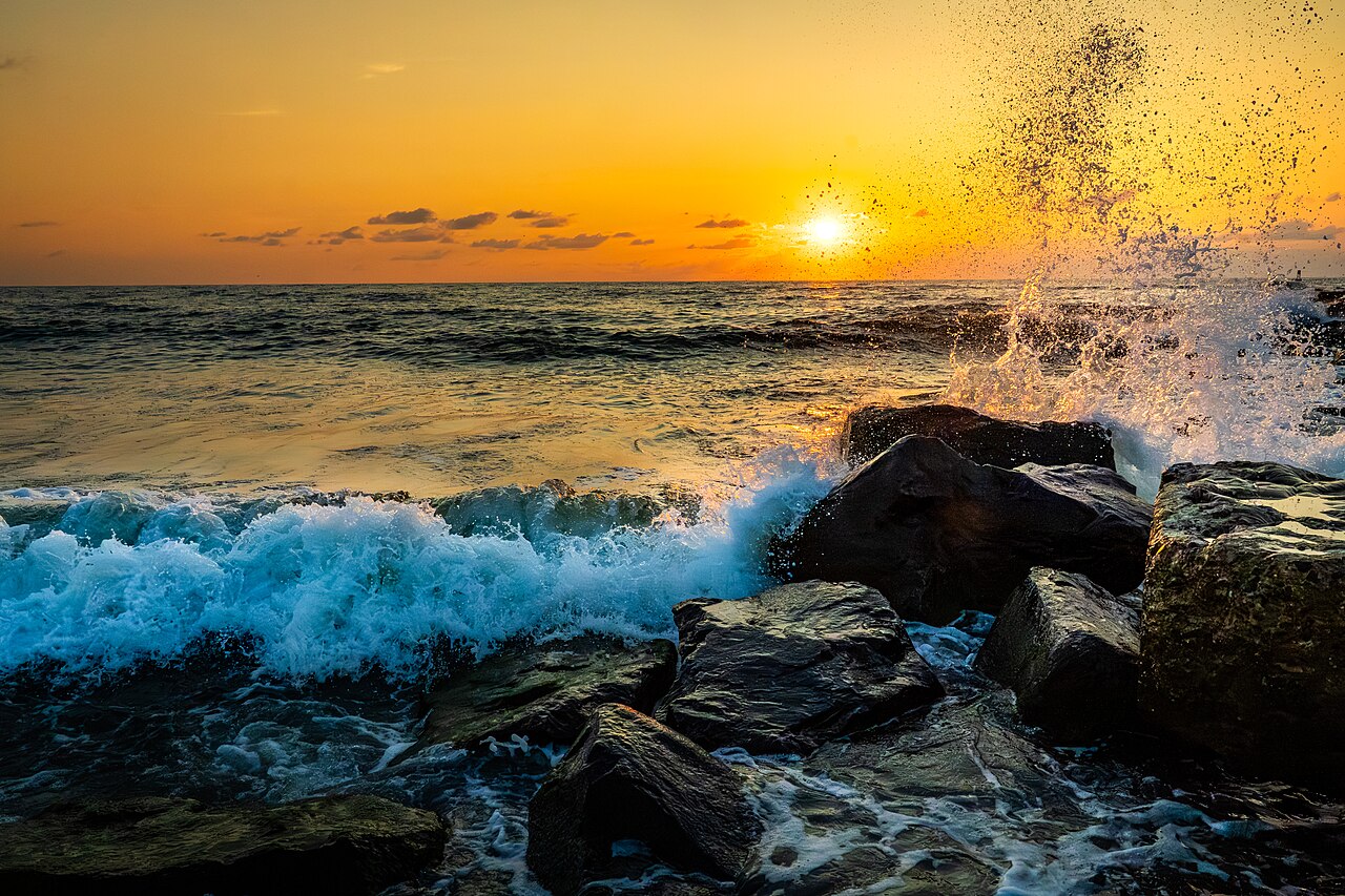 The sun rising over the sea