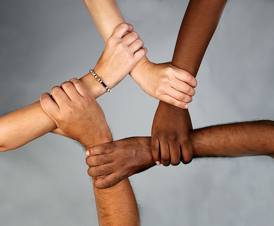 Hands of diverse people clasped together