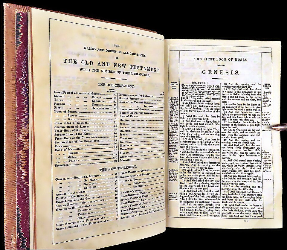 An 1873 edition of the Bible, opened to Genesis chapter 1
