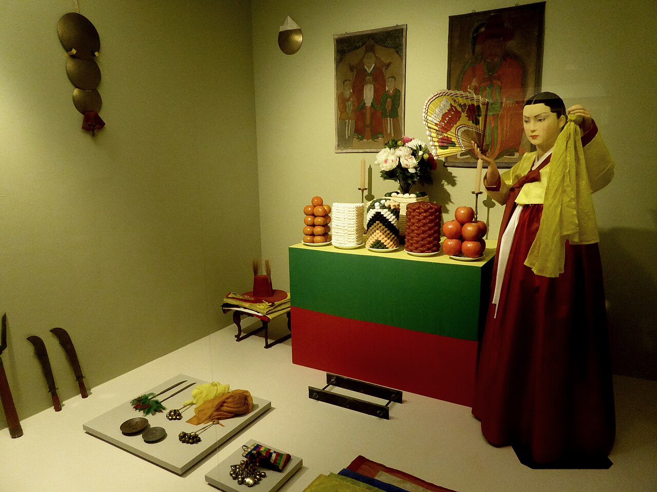 A shamanic shrine diorama at the National Museum of Korea — a shaman figure and altar