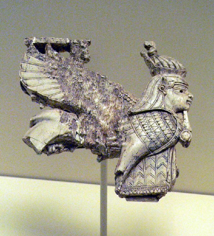 An ivory plaque carved with a winged figure, excavated at Nimrud