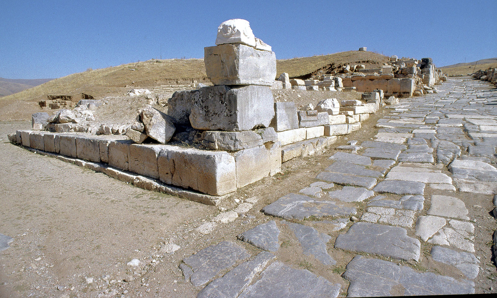 The Roman paved main street and fallen stonework of the ruins of Pisidian Antioch