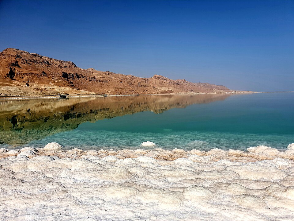 The southern shore of the Dead Sea, with salt formations along the water