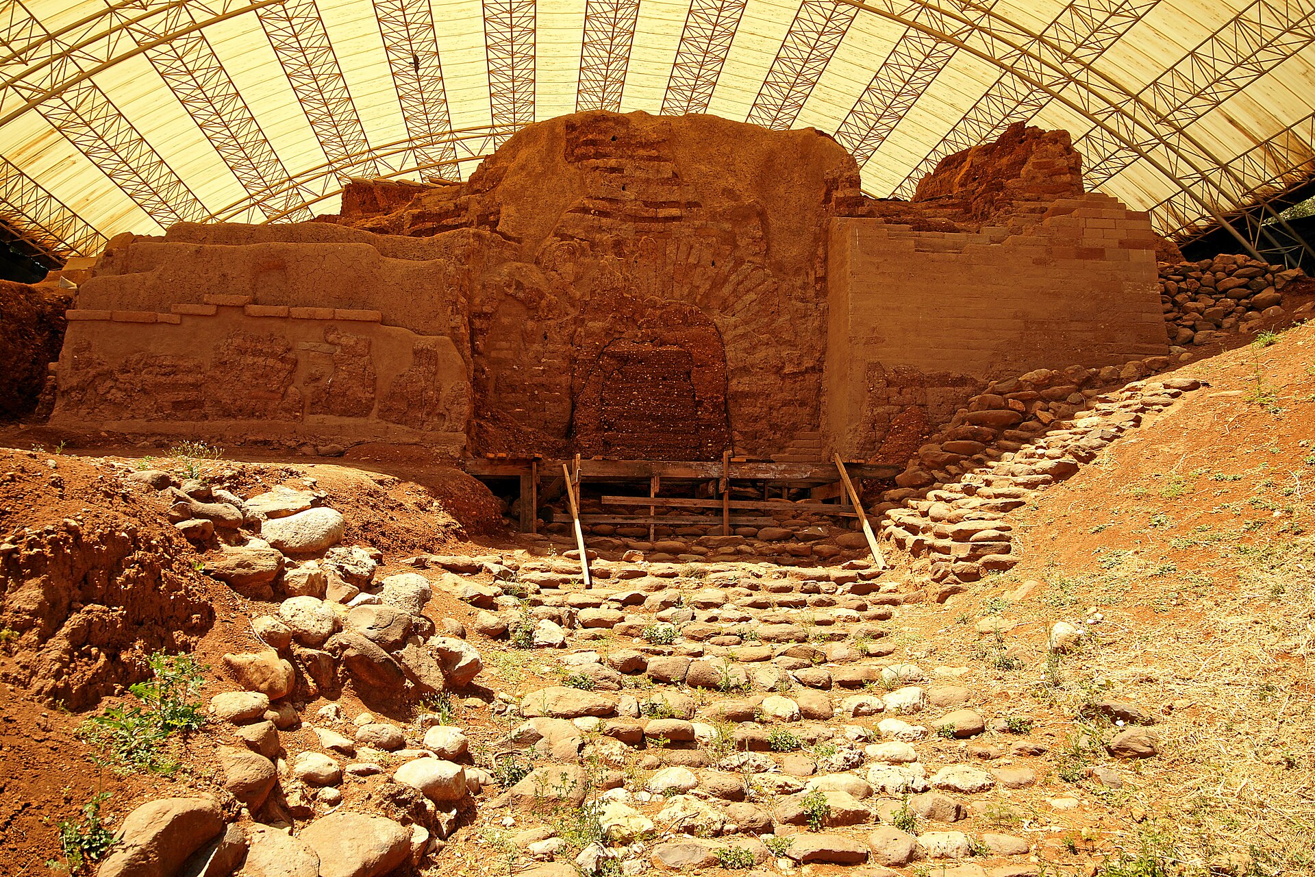 The mud-brick city gate excavated at Tel Dan, under a protective canopy. It is dated to the Middle Bronze Age and is popularly called Abraham's Gate, but the Bible does not record that Abram passed through this gate.