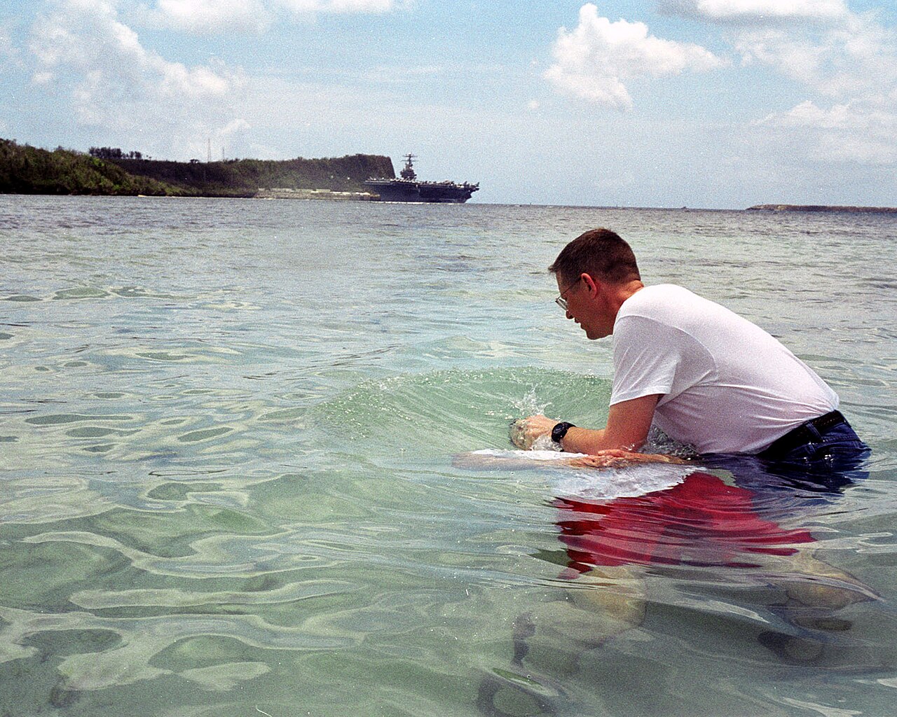 An immersion baptism at Apra Harbor, Guam, in 2003, illustrating water baptism today.