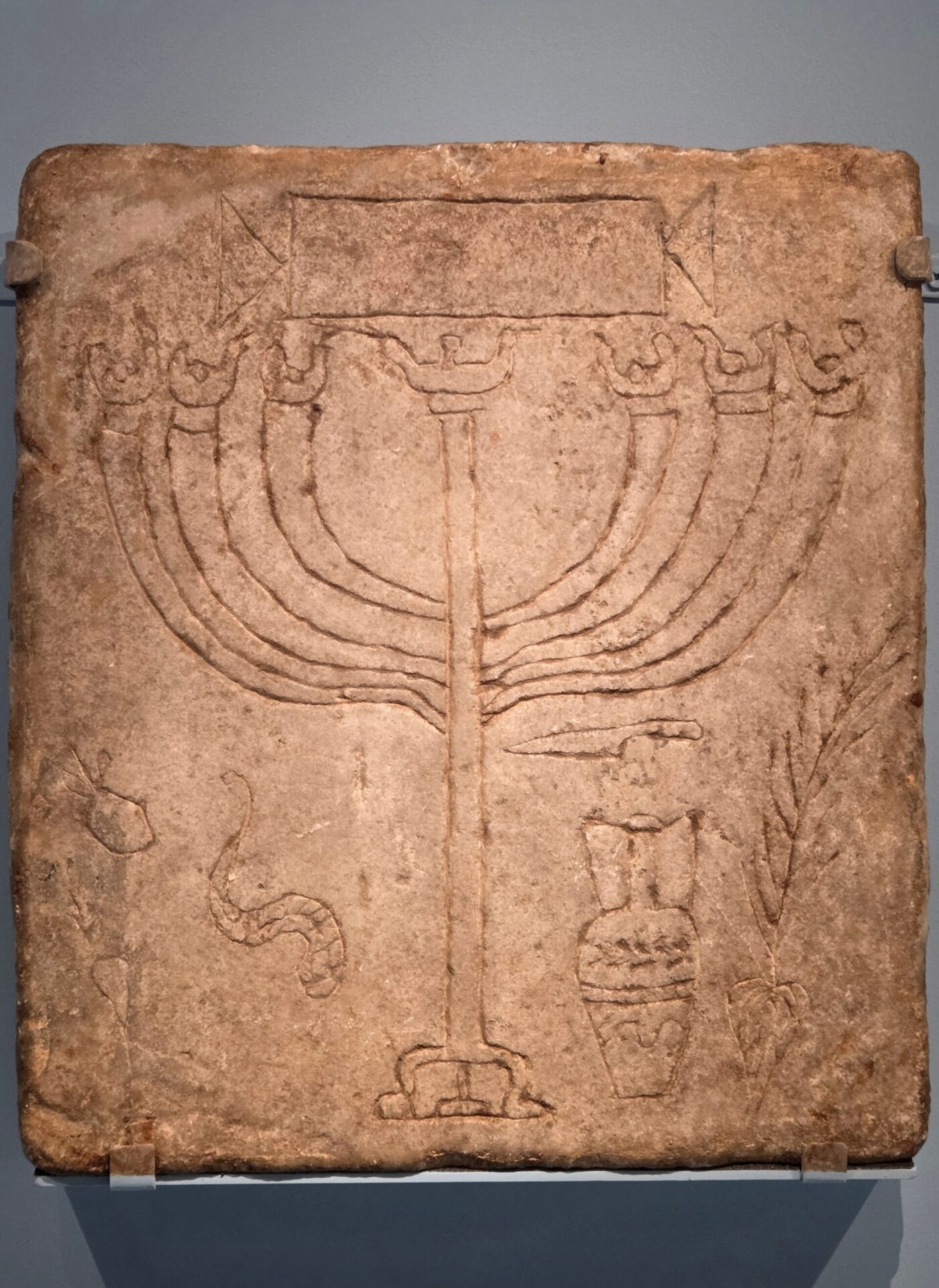 Jewish burial plaque from the Vigna Randanini catacomb in Rome, incised with a seven-branched lampstand (menorah)